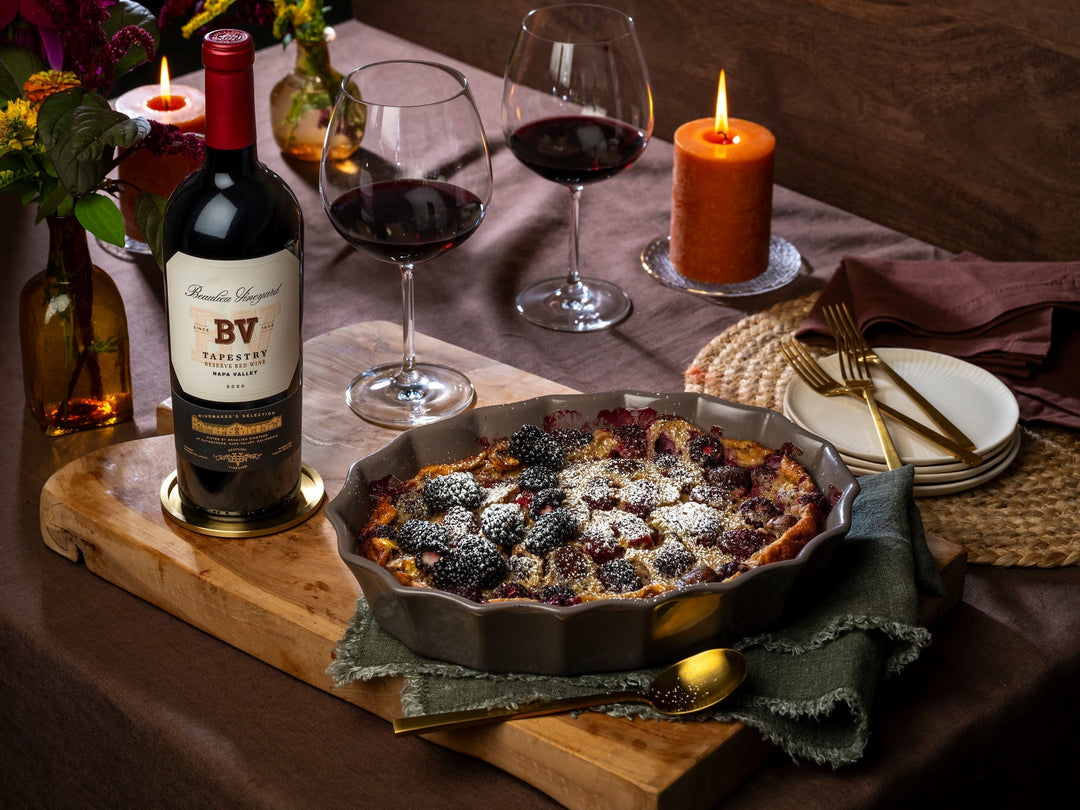 Blackberry chestnut clafoutis on a table with Beaulieu Vineyard wine and autumn tablescape.