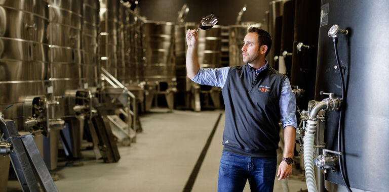 Trevor Durling Sampling Wine in Cellar