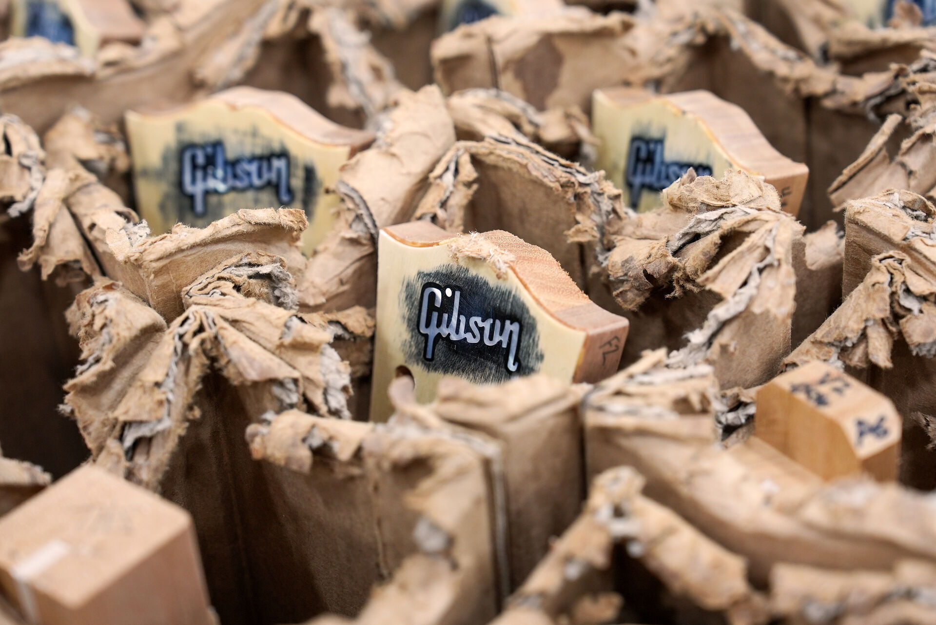 Unfinished wooden guitar headstocks with Gibson logo
