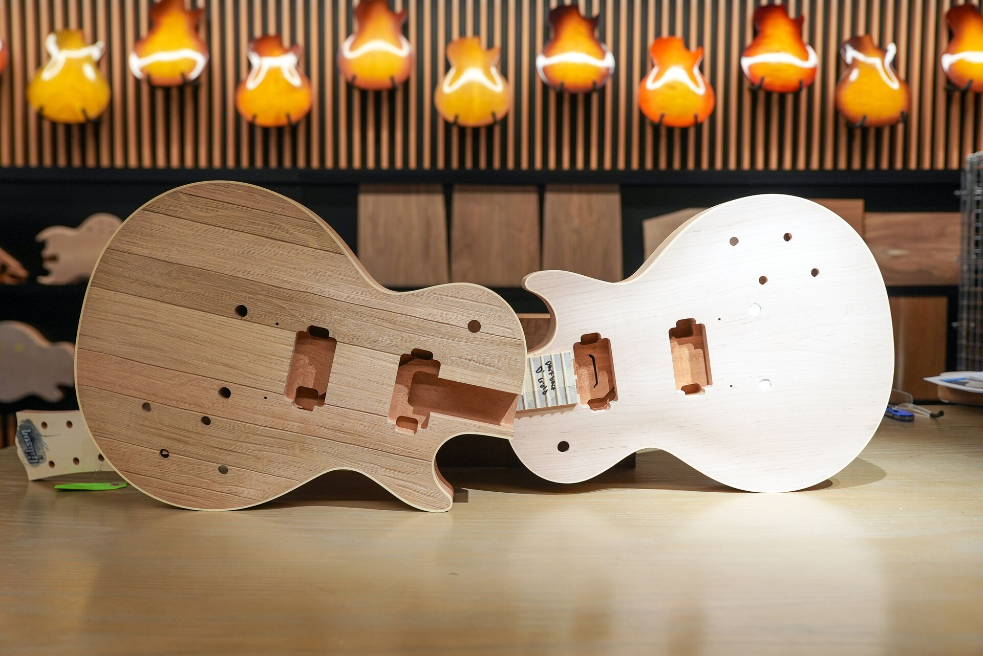 Unfinished wooden guitar bodies on a workbench