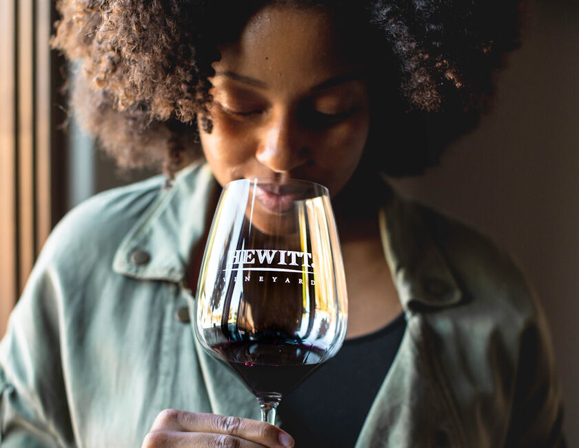 Woman enjoying Hewitt Vineyard wines